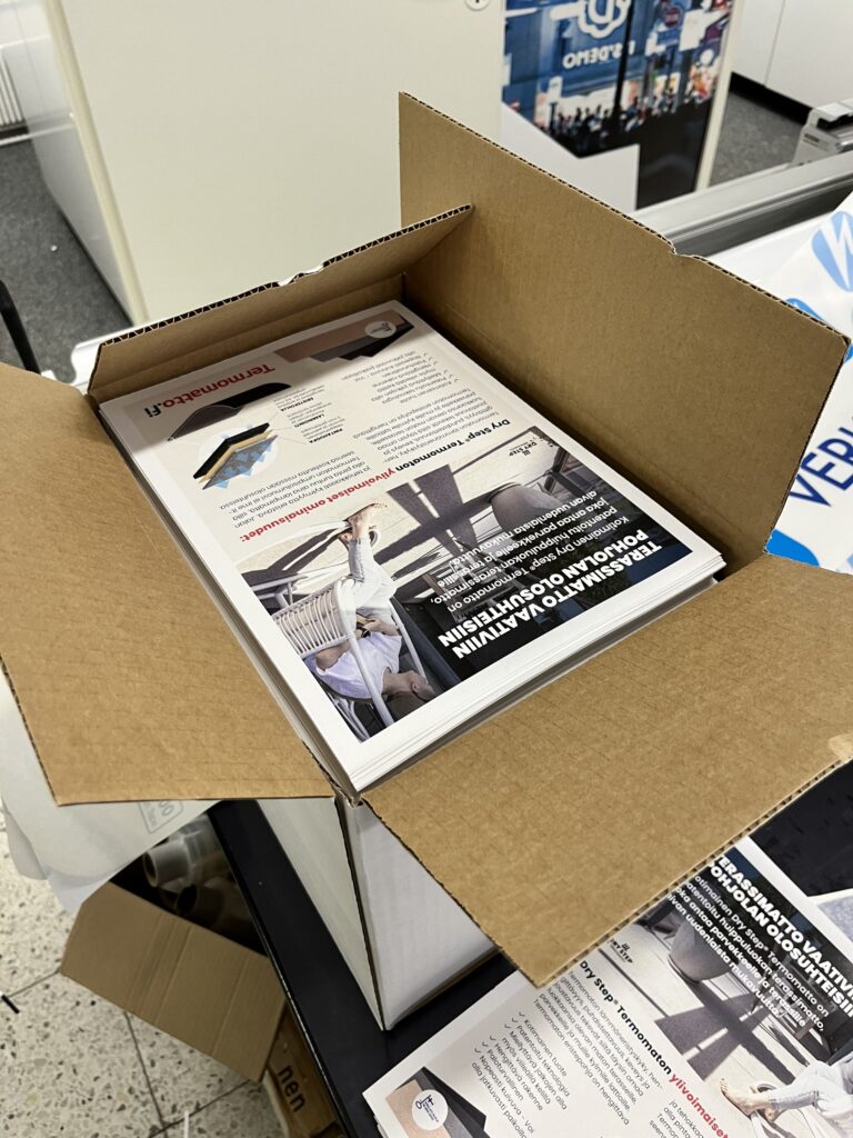 Termomatto esitteet laatikossa